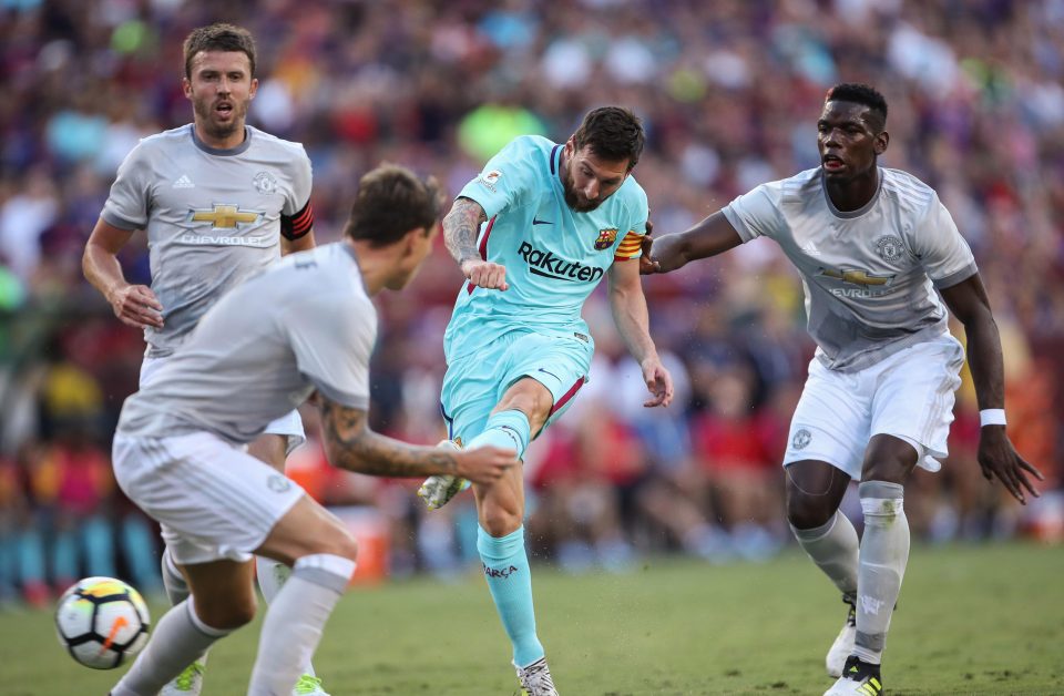  Lionel Messi unleashes a shot at the Man United goal