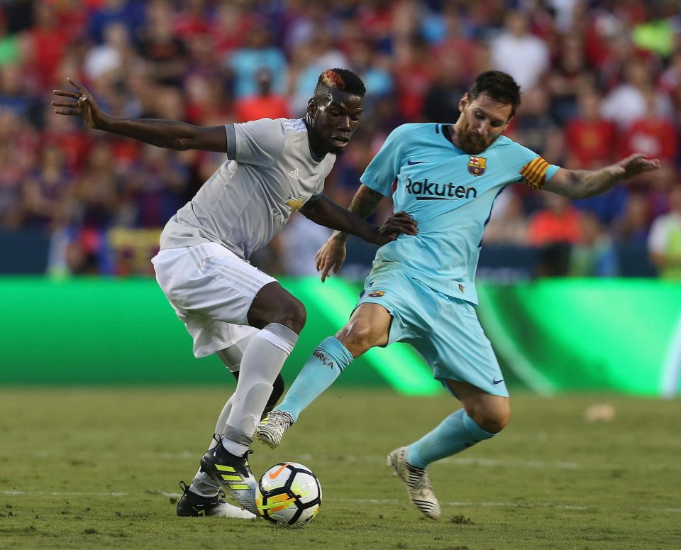  Paul Pogba battles with Lionel Messi during the friendly in the US