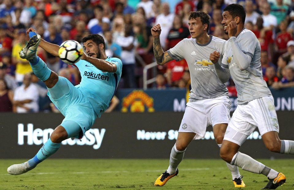  Luis Suarez attempts an overhead kick during the first half