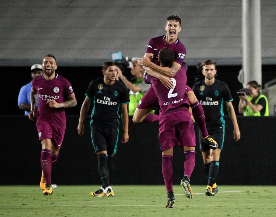  John Stones celebrates his strike with Kyle Walker