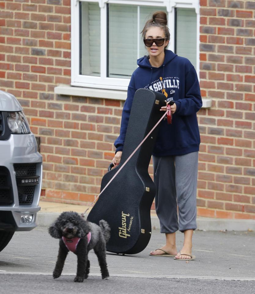  Megan arrived home with a Gibson guitar