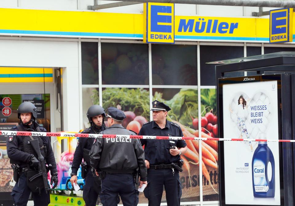  Armed cops stand guard at the scene of the deadly supermarket attack