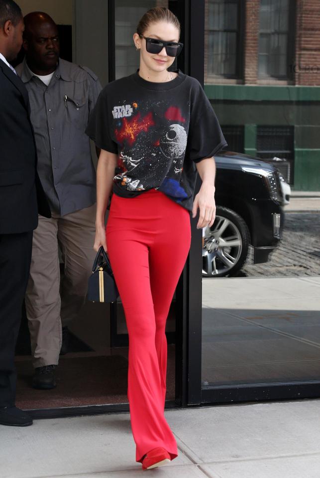  Gigi Hadid was pictured leaving her Manhattan apartment on Friday morning in a pair of bright red flares