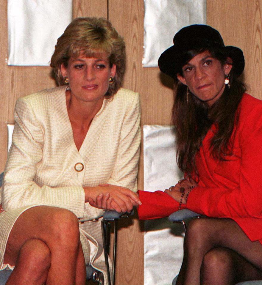  The Princess of Wales holds hands with Aids victim Aileen Getty during a visit to an Aids centre in 1996