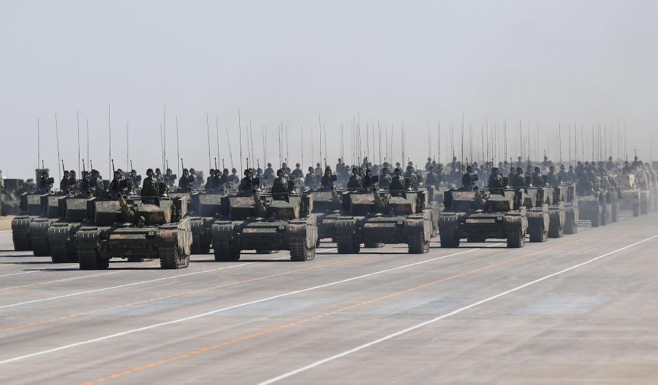  Scores of tanks rolled down the parade ground on an airstrip