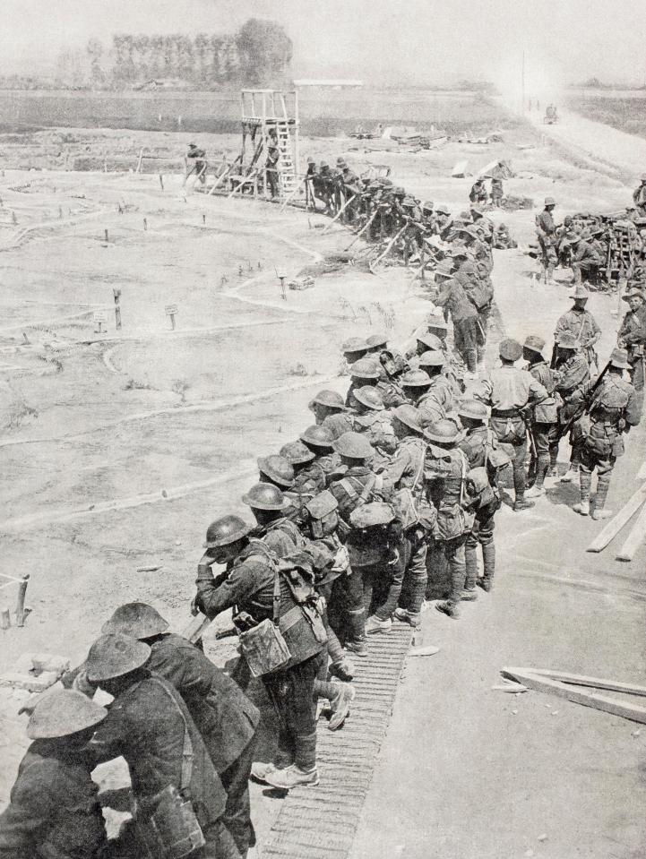  Troops study a massive model of the decimated battlefield