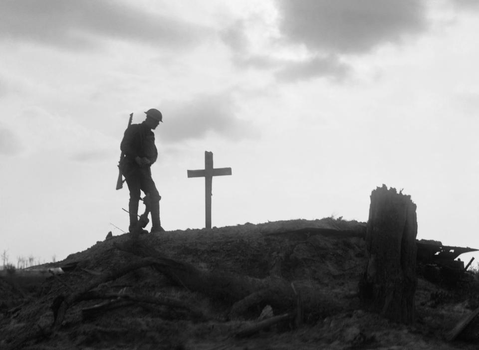  A British soldier stands besides the grave of a comrade near Pilckem during the Third Battle of Ypres in August 1917