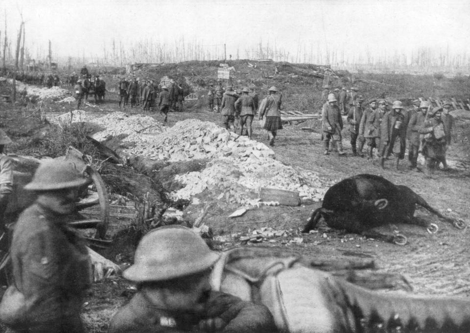  Troops move through scarred terrain in Flanders, 1916. As many as a quarter of a million British soldiers are estimated to have died in the four month battle