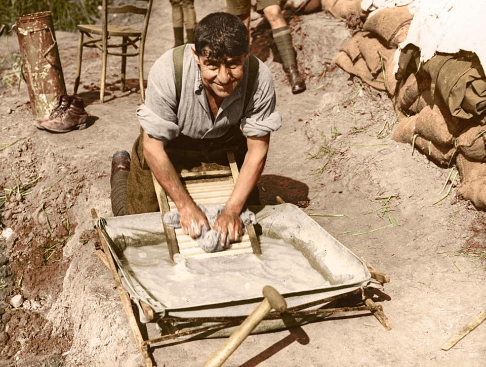  A soldier scrubs his uniform. The mud was was a deadly enemy, spreading disease and making it next to impossible to cross the battlefield