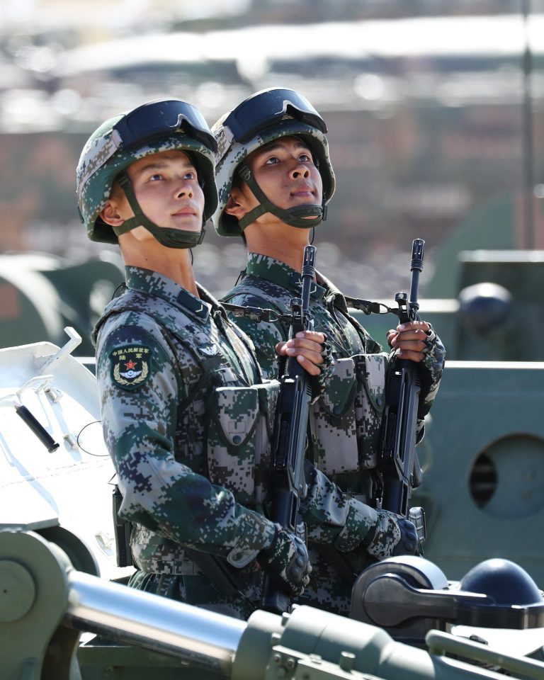  And soldiers stood to attention as they rolled past President Xi