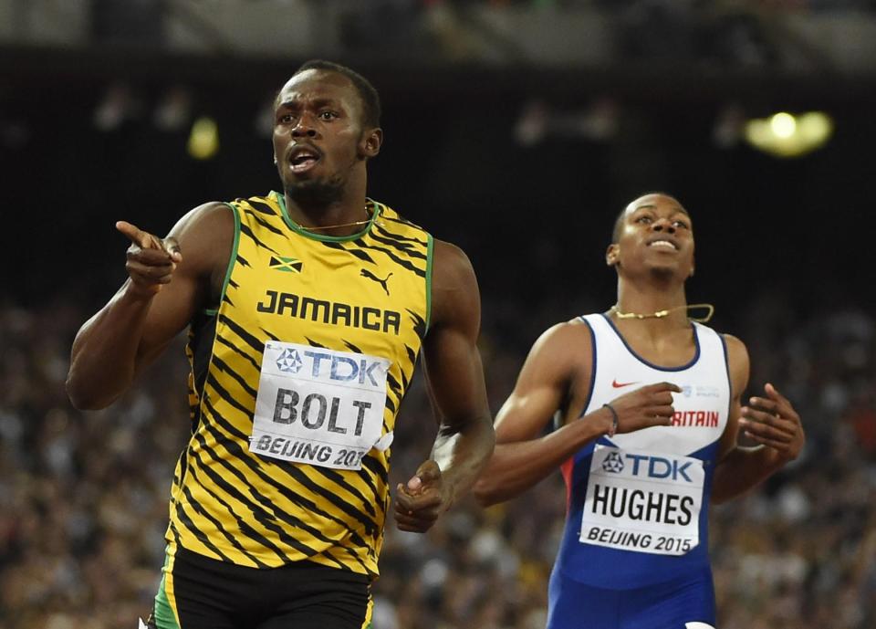  Hughes trails Bolt as the Jamaican wins the world 200m title in Beijing in 2015