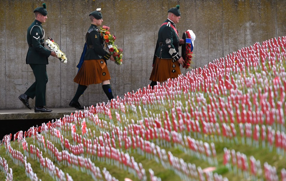 Members of the Irish brigade carry wreaths to place at the Tyne Cot cemetery