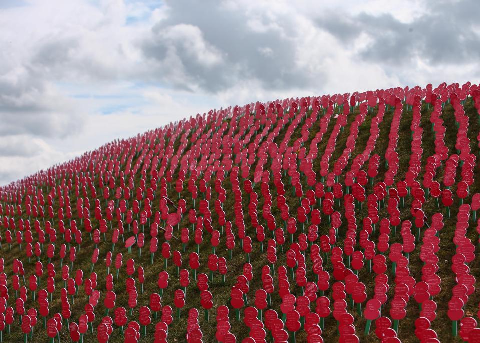  A sea of memorial poppies at Tyne Cot cemetery, Ypres, today where commemorations are being held