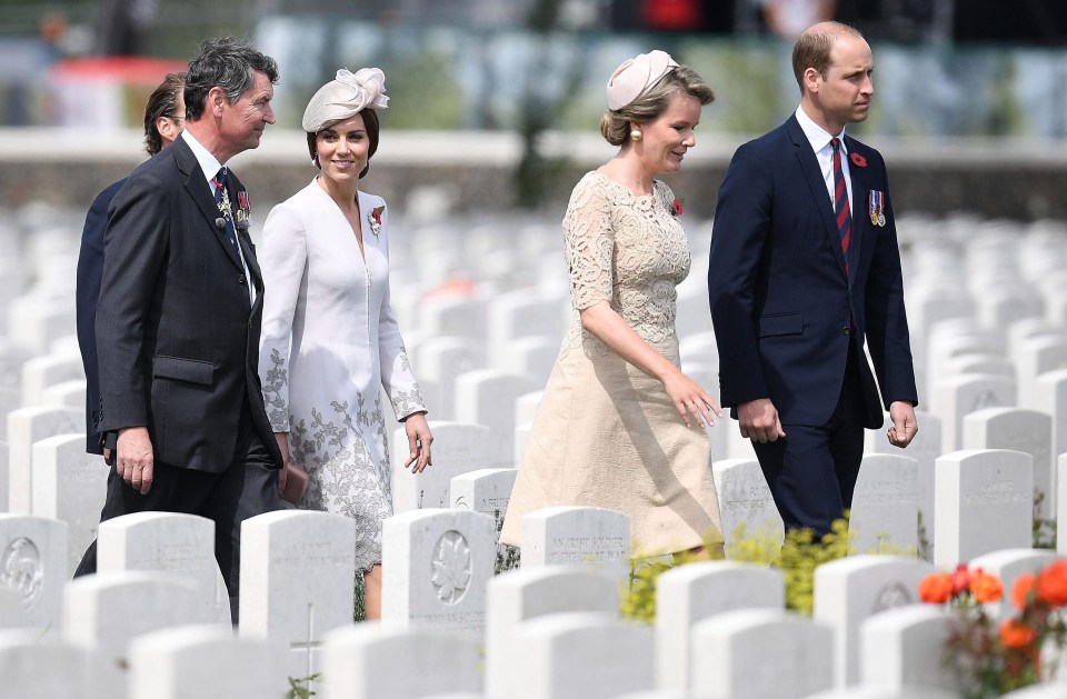 Kate walks alongside Vice Admiral Sir Timothy Laurence, while William strides next to Queen Mathilde of Belgium at Tyne Cot cemetery