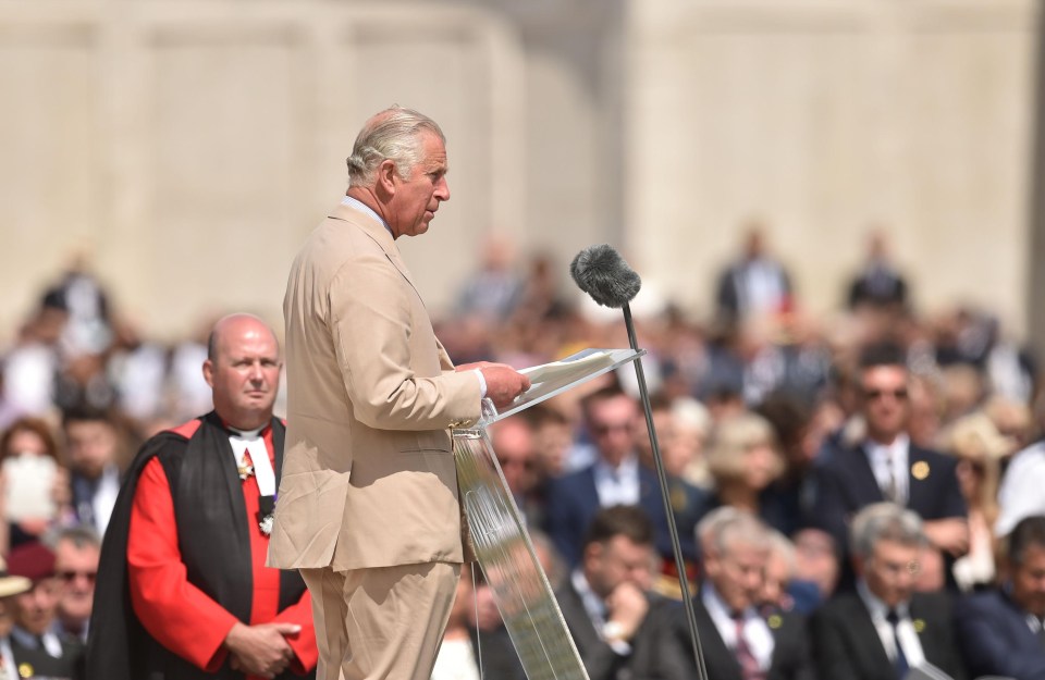 Prince Charles addresses guests as he leads the ceremony at Tyne Cot today 