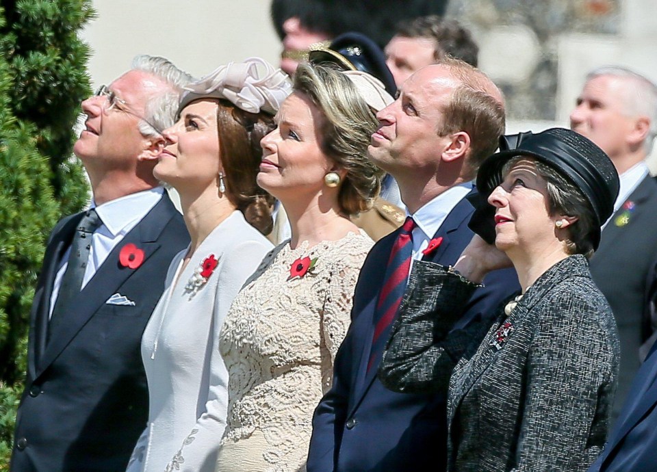 King Philippe of Belgium, Britain’s Catherine, Duchess of Cambridge, Queen Mathilde of Belgium, Britain’s Prince William, Duke of Cambridge and British Prime Minister Theresa May look at the fly past