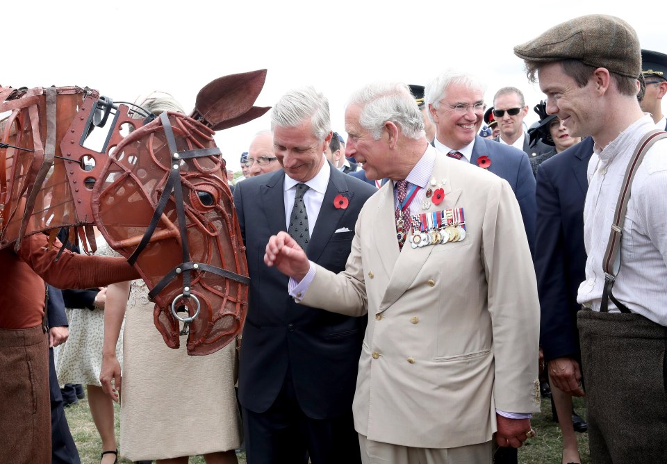 King Philippe and Prince Charles inspect a War Horse sculpture during the event