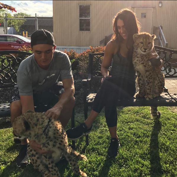  Rickie and Allison pose with two leopards at Columbus Zoo