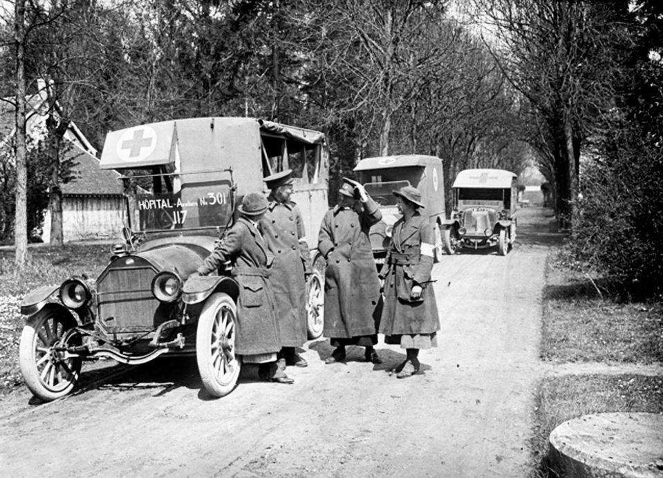  Ambulance drivers of the Scottish Women's Hospital talking on the street, probably in Troyes, France