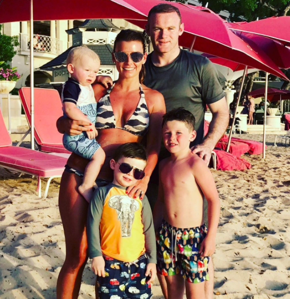  Coleen Rooney, pictured with husband Wayne and their three sons,  is pregnant with her fourth child