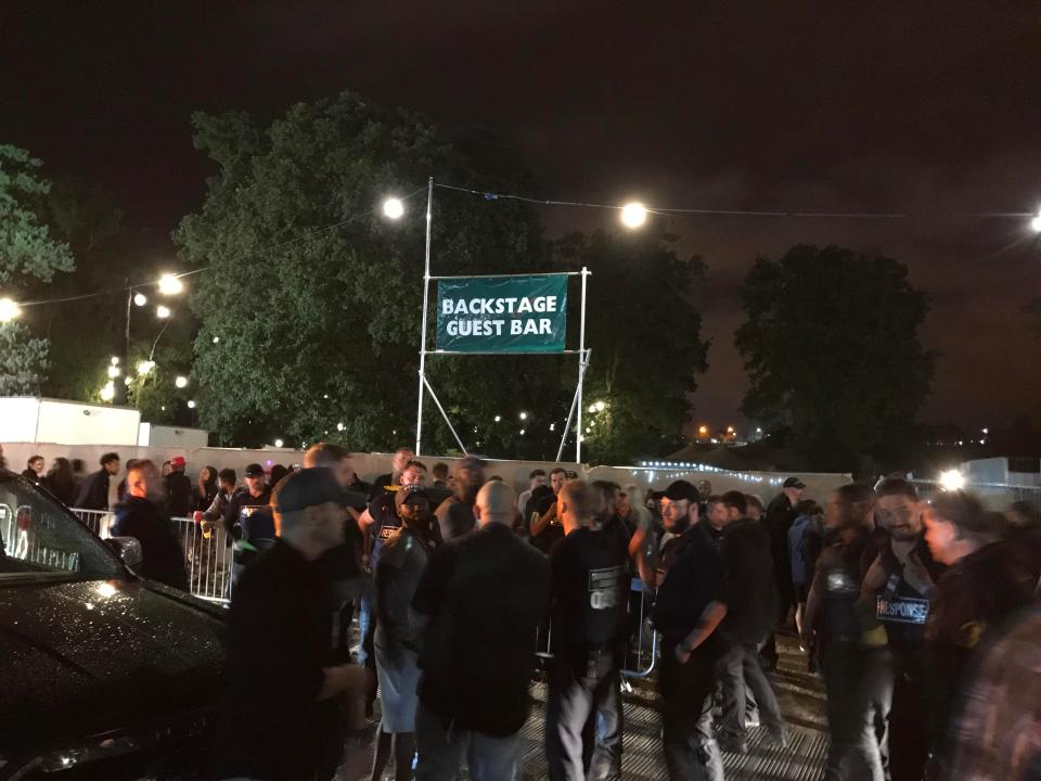  Evacuees congregated outside the backstage bar after the event