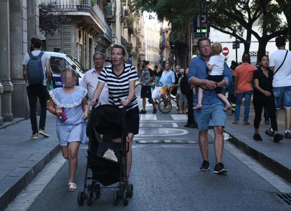  People flee the scene in Barcelona after a white van jumped the sidewalk in the historic Las Ramblas district