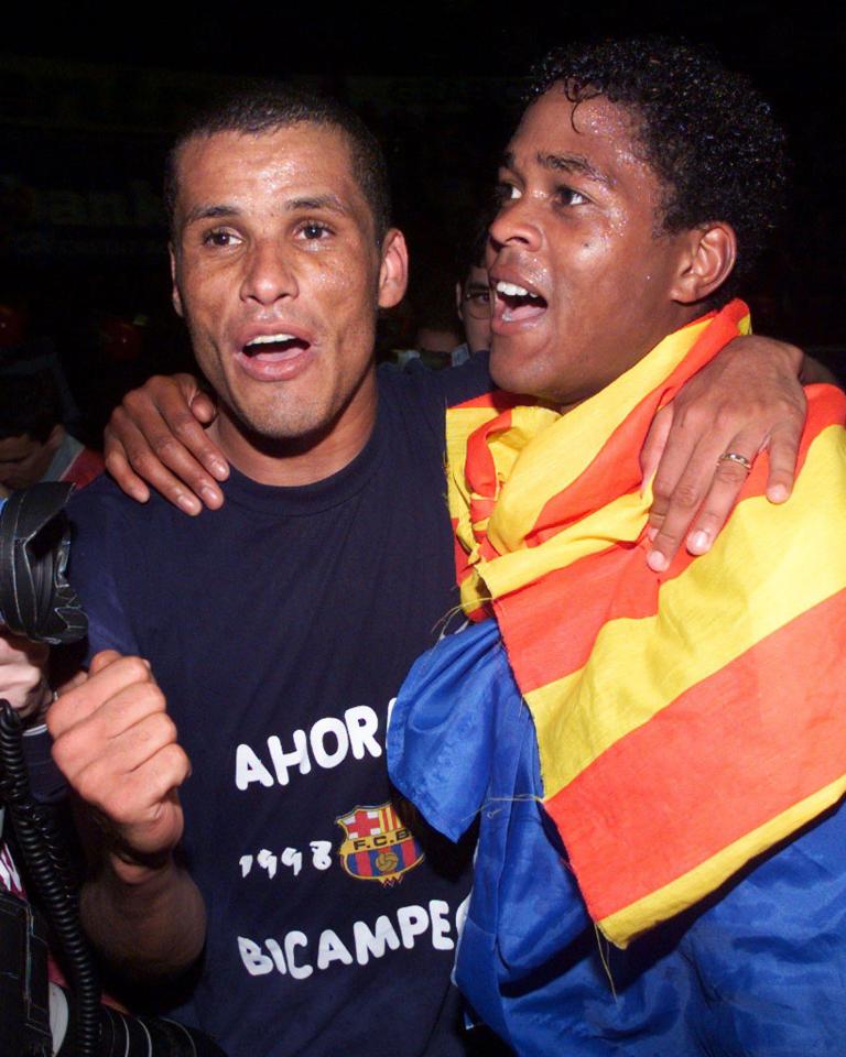  The Holland hero celebrates with Brazil icon Rivaldo during Barcelona's La Liga-winning season in 1999