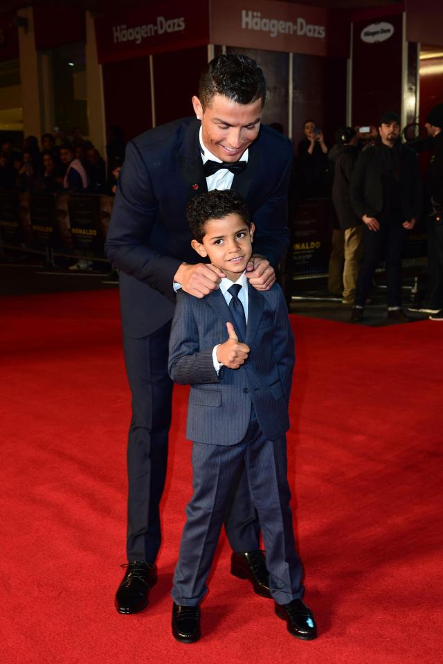  Cristiano Ronaldo posing with his son Cristiano Ronaldo Jr