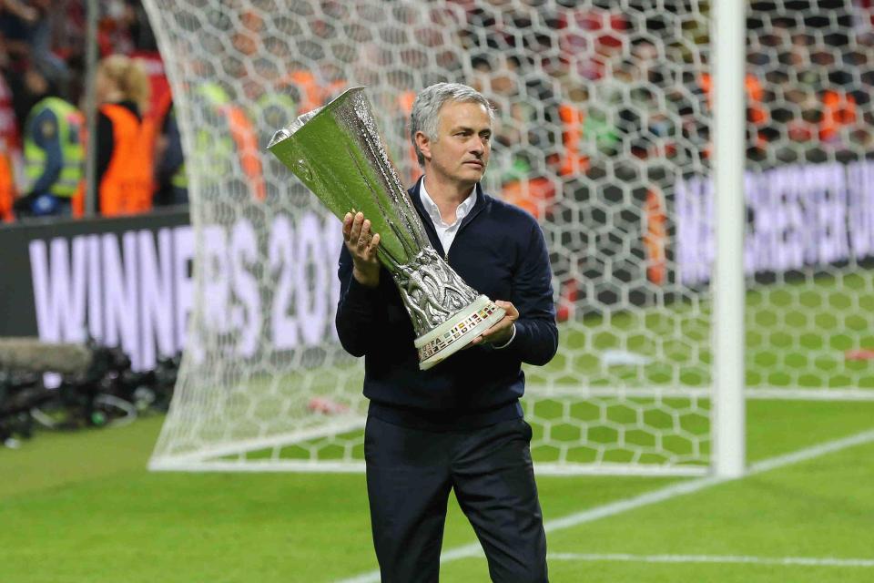  Jose Mourinho celebrates with the Europa League after beating Ajax