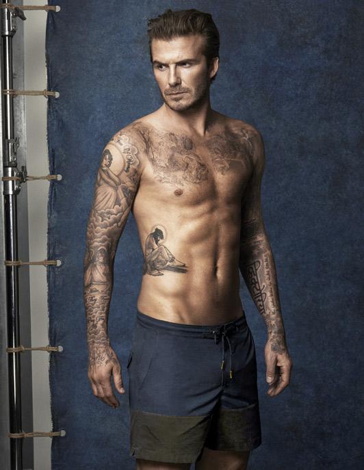  David Beckham sports several tattoos over his biceps, chest and abdomen