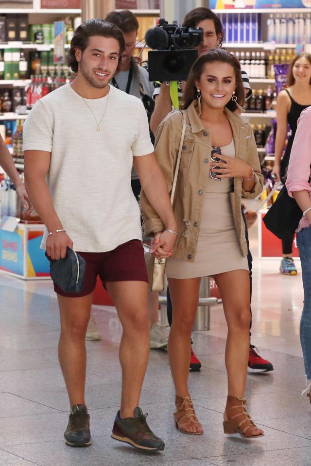  Kem Cetinay and Amber Davies pictured at the airport after scooping prize