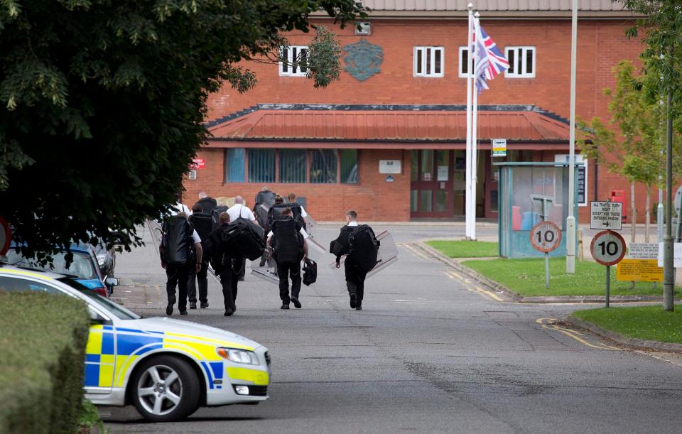  Riot squad and a police car swoops on the Hertfordshire prison yesterday afternoon