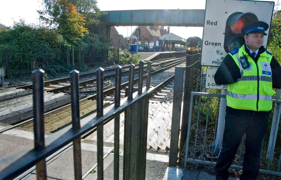  The current level crossing is controlled by locked gates and a security guard