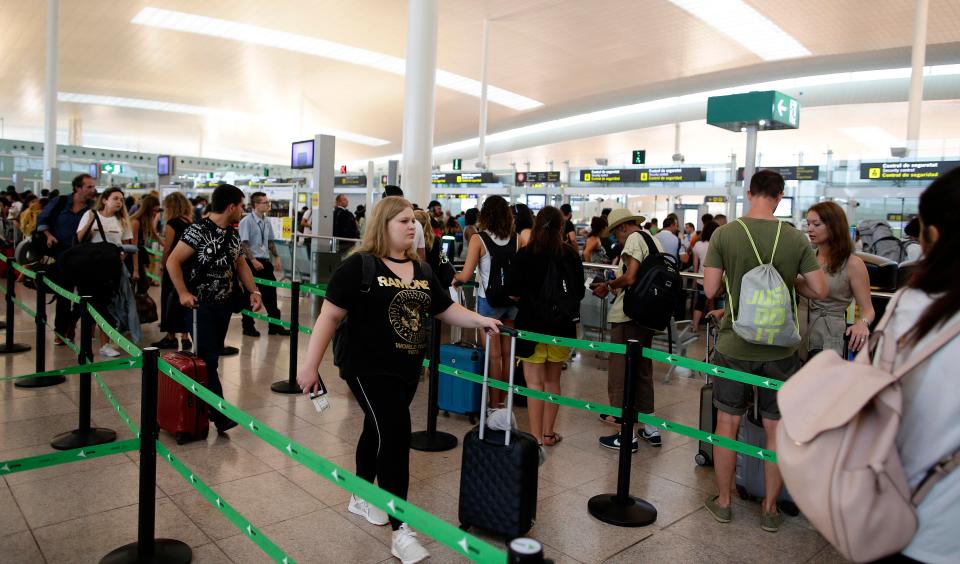  Long queues formed at Barcelona Airport yesterday as tough new EU border checks were brought in