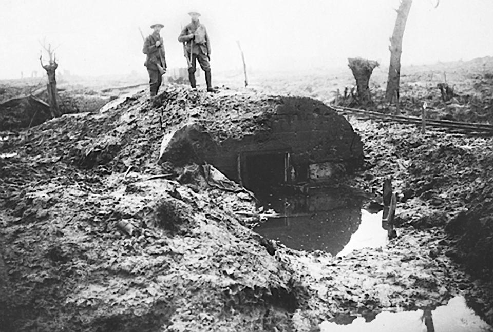  Two soldiers assess the damage at a flooded dugout on the Flanders battlefield