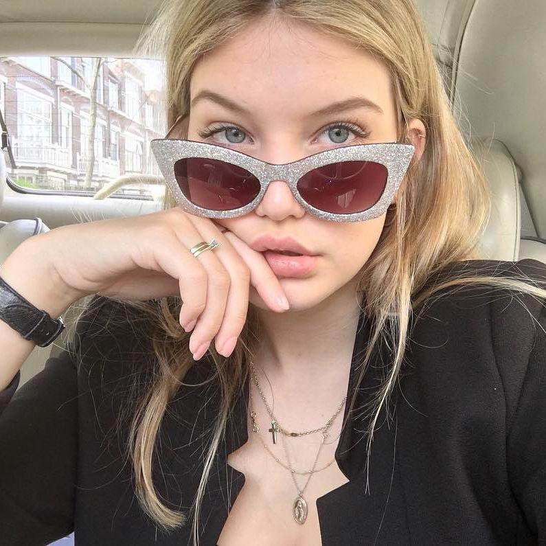  Like Gigi, Iza (pictured) likes to pose with sunglasses half down her nose and accentuating the trademark pout