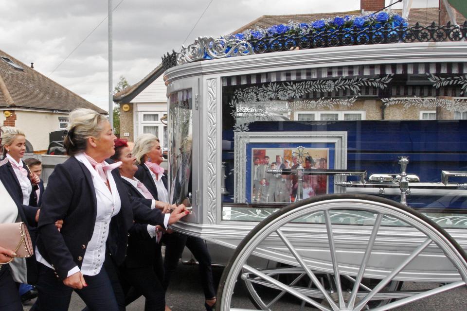  A photograph accompanied his coffin as it was carried to the cemetery