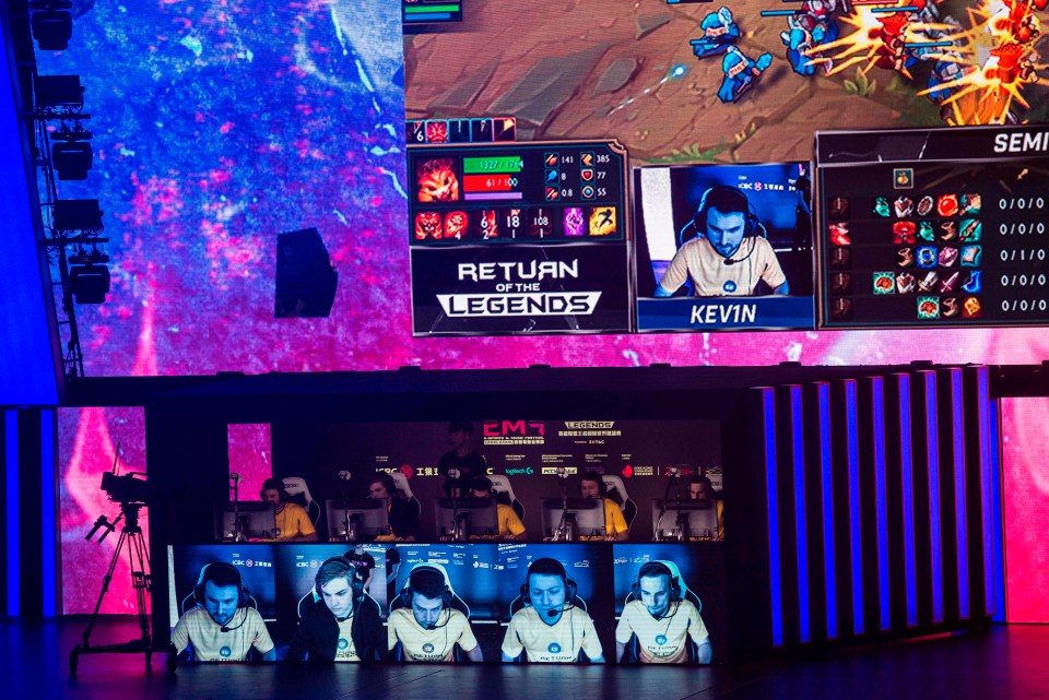 Team Hong Kong, Taiwan and Macau (C) play on stage in the League of Legends gaming tournament