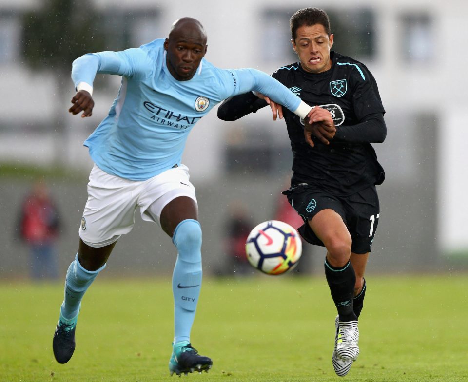  Mangala takes on West Ham's Javier Hernandez during their friendly in Iceland