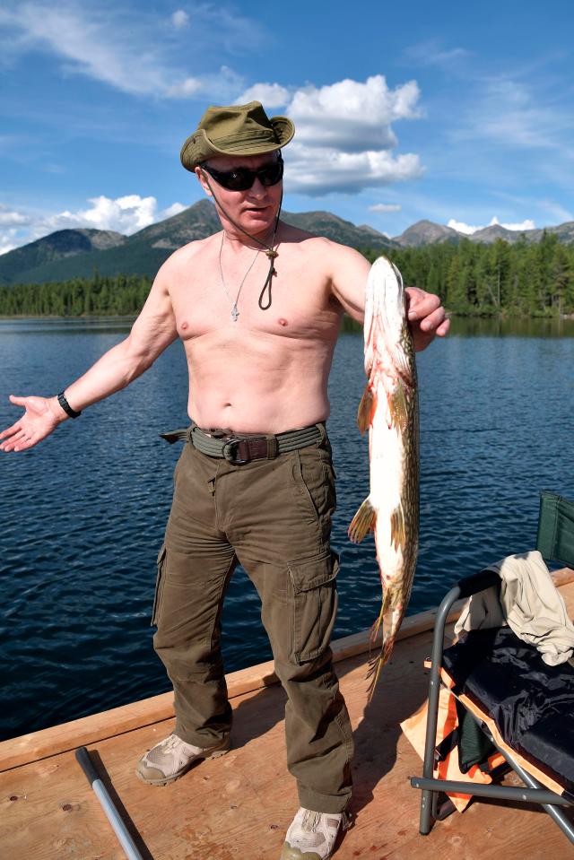  What a catch ....Putin shows off the fish which he spent hours chasing