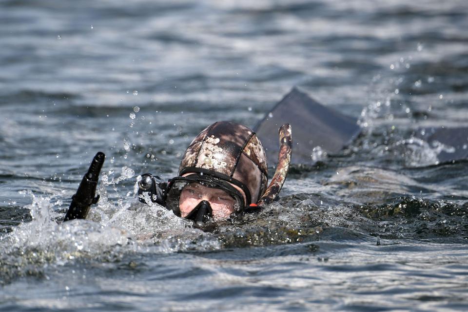  The president dives into the lake which is more than 5,000 ft deep