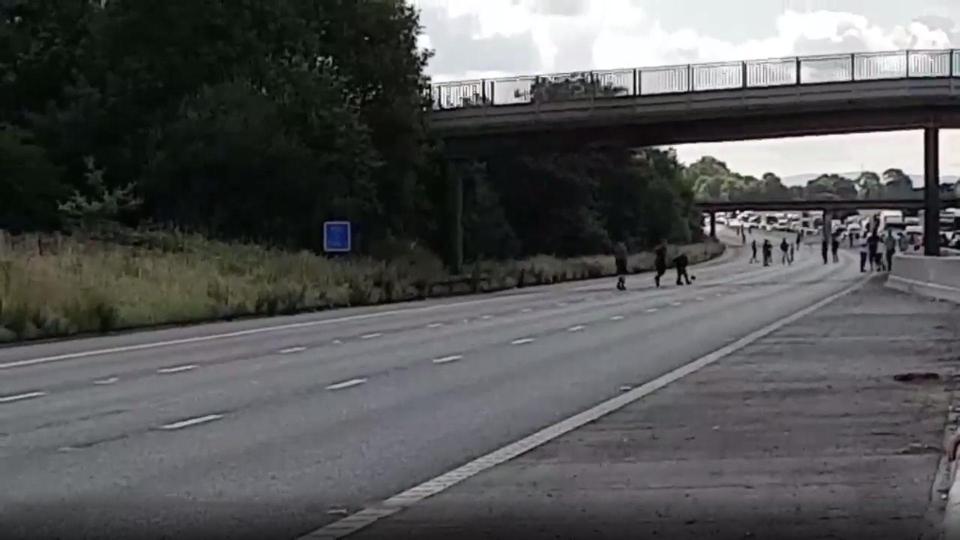  Video and images posted on Twitter appeared to show people playing rugby on the busy motorway in Cheshire