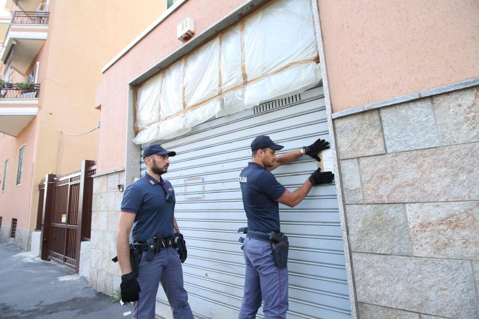  Cops are pictured sealing up the office space where the alleged kidnapping occurred