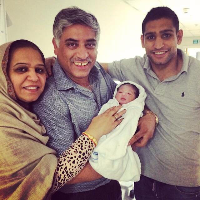  Boxer Amir Khan Amir Khan pictured with parents Sajjad Khan and Falak Khan and his daughter