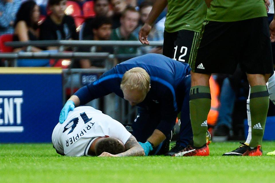  The Spurs full-back slumped to the turf and had to be taken off in the Wembley win