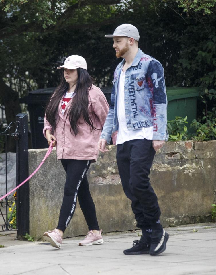  The pair both wore white tees and black bottoms