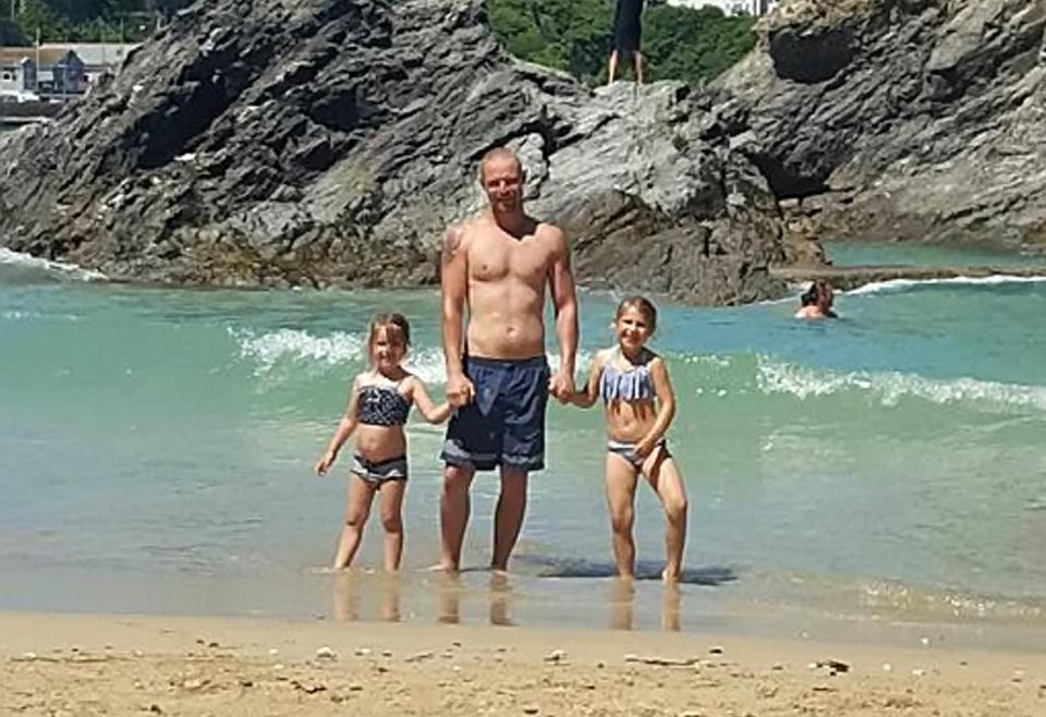  Adam Fenton with his children playing on the beach where he was found dead just two weeks before the tragic incident