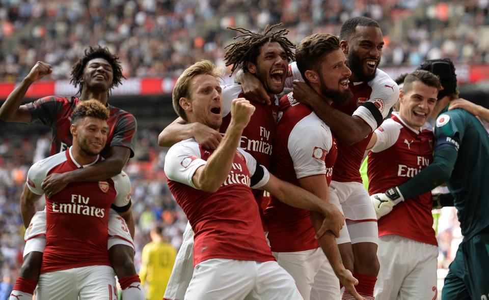  The Gunners celebrate after winning the Community Shield after they beat the Blues 4-1 on penalties