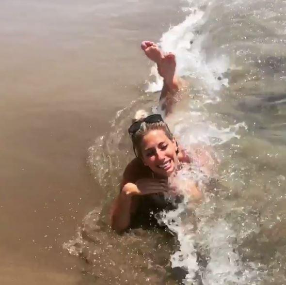  Stacey Solomon attempted to strike a perfect pose on holiday today but ended up being knocked over by waves