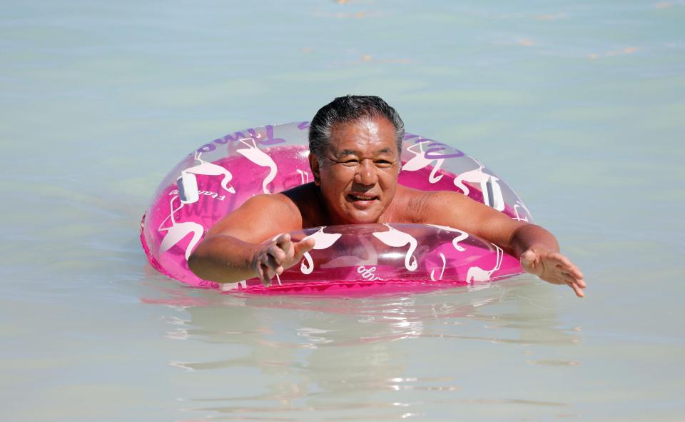  A tourist enjoys the waters off the Tumon Beach on the island of Guam